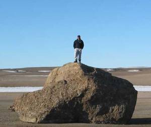man standing on rock