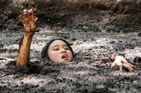 woman stuck in mud pit